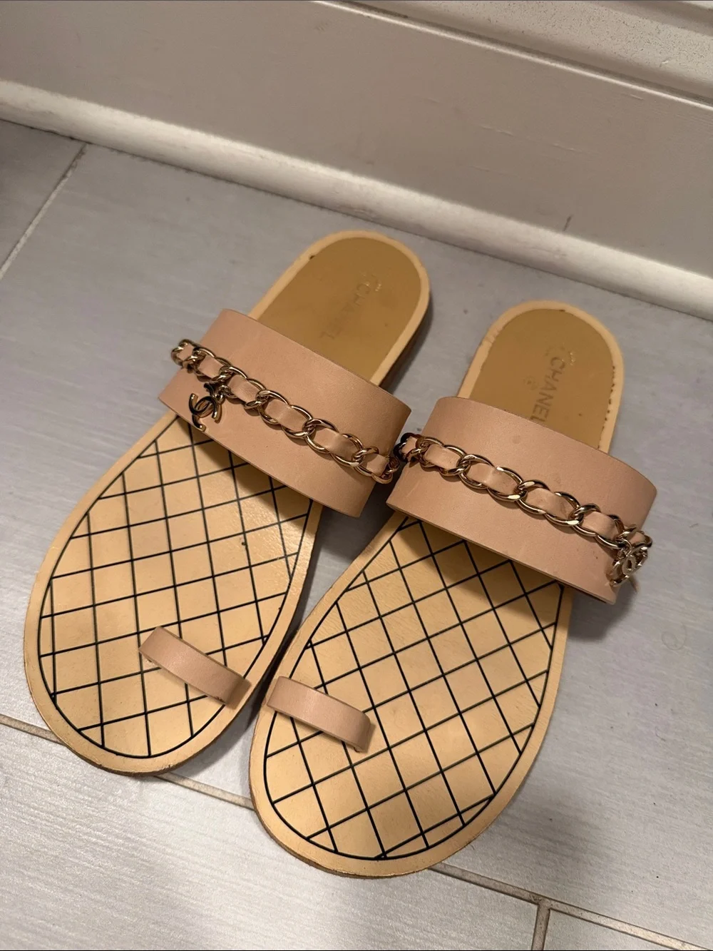 CHANEL Beige Slip-On Sandals with Gold Chain Accent